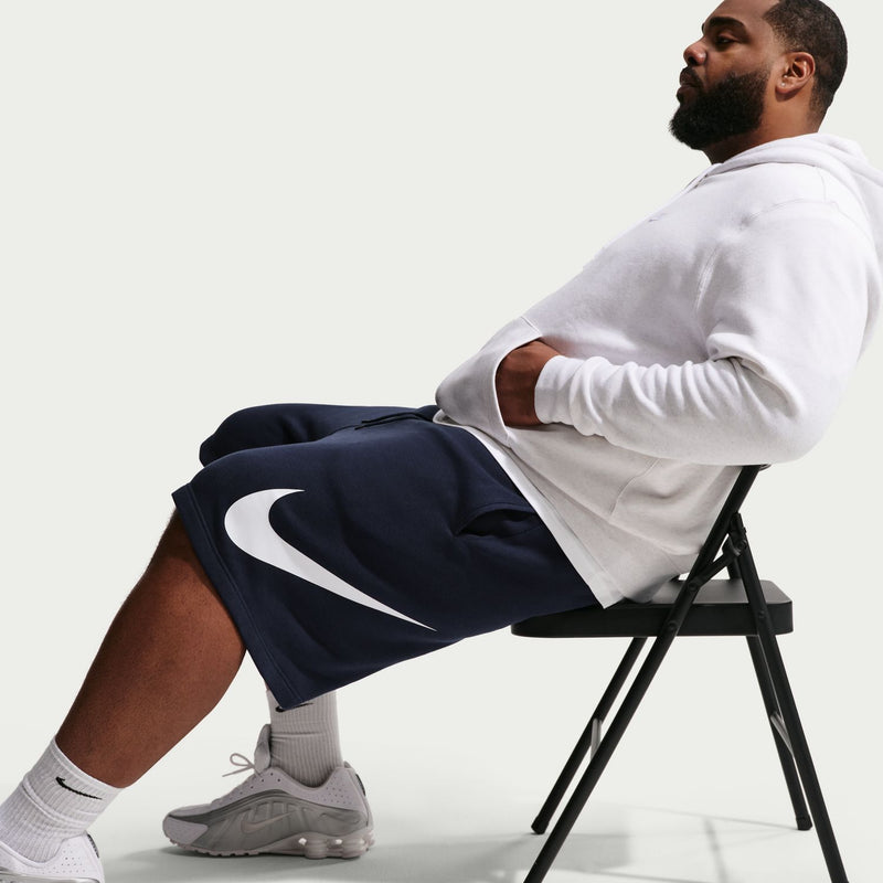 Men's fleece shorts, dark navy, white swoosh graphic on side; relaxed fit
