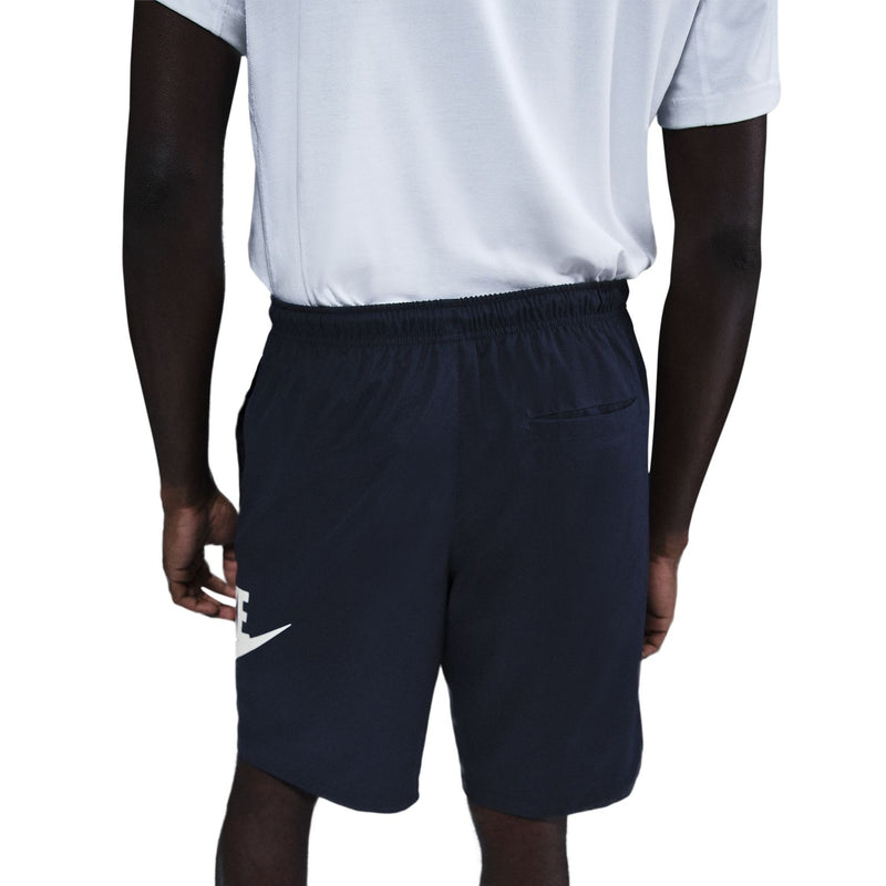 Dark navy woven shorts close-up: elastic waistband with drawstring, Nike side logo