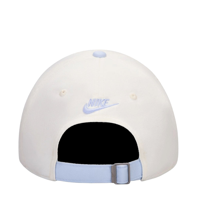Cream cap with curved light-blue bill, Nike logo and adjustable strap