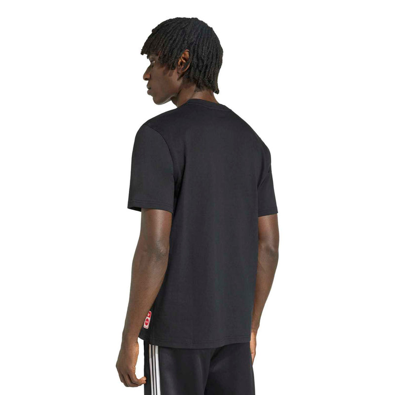 Men's black T-shirt back view with small red logo detail near hem