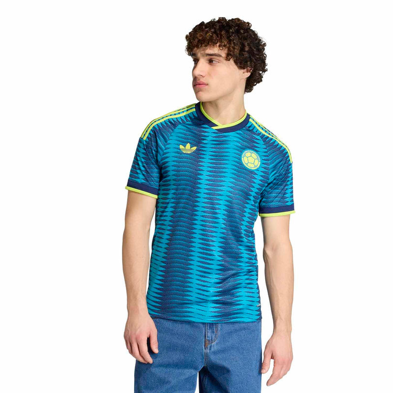 Men's Colombia away soccer jersey front view, turquoise zigzag print with yellow trim