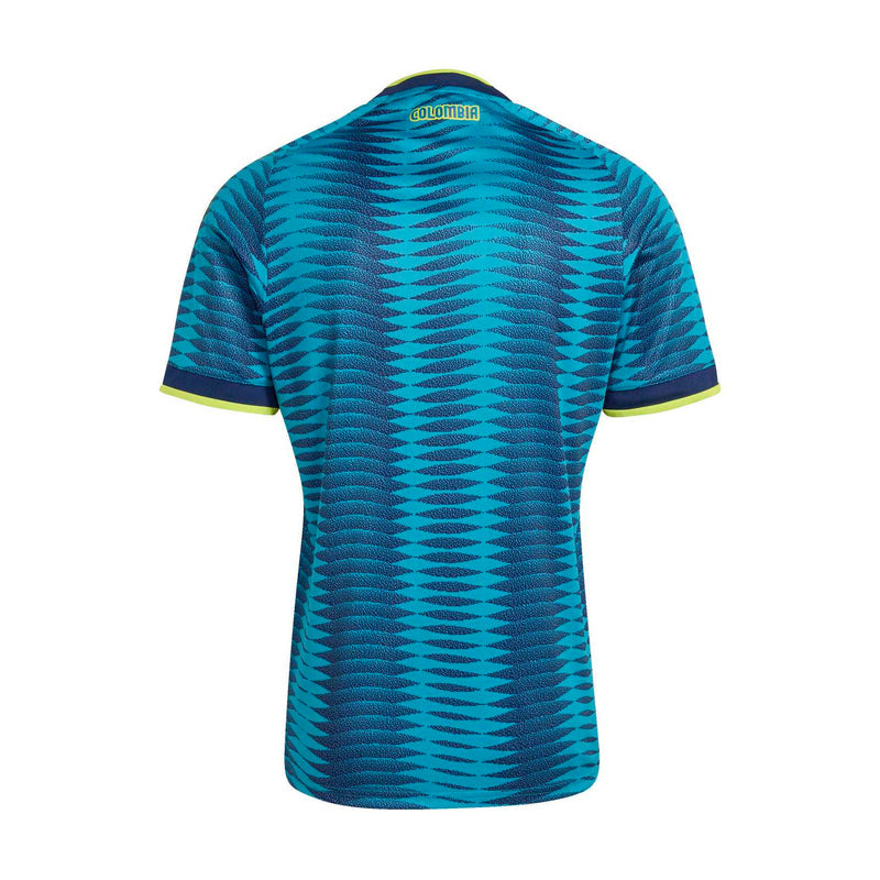 Men's Colombia away soccer jersey back view, turquoise zigzag pattern with yellow trim
