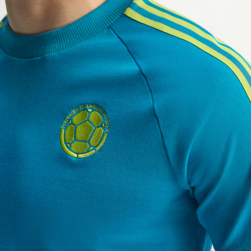 Teal crewneck T-shirt with embroidered soccer-ball crest emblem on chest