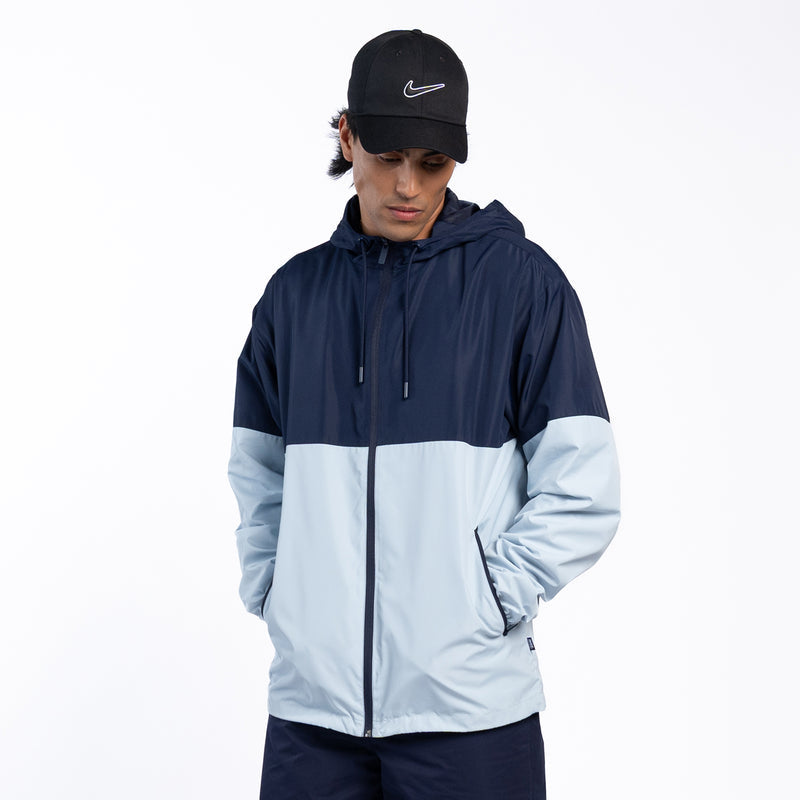 Mens colorblock windbreaker with adjustable hood, navy and light blue, full zip front.