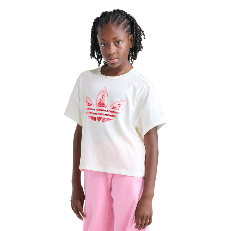 Youth off-white confetti trefoil graphic tee on model, front view with pink pants