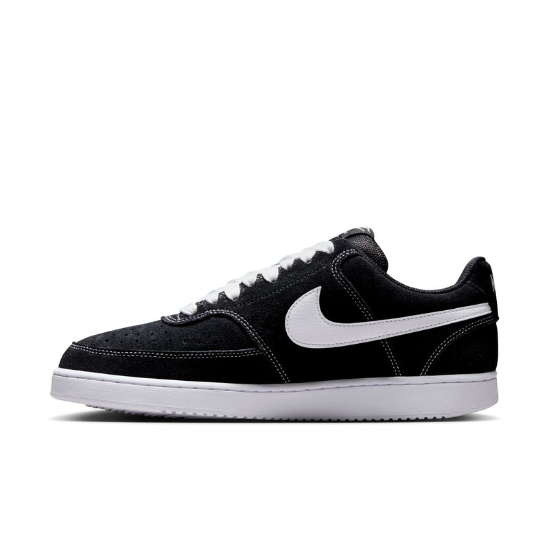 Black low-top sneaker with white Swoosh, white laces, and textured paneling