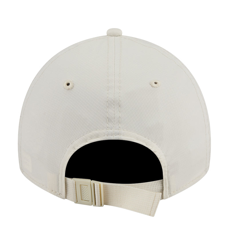 Cream strapback cap back view with black headband and adjustable buckle