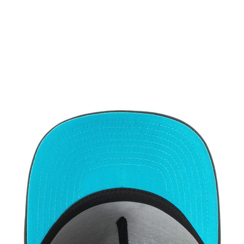 A-frame baseball cap with turquoise underside brim and stitched panel