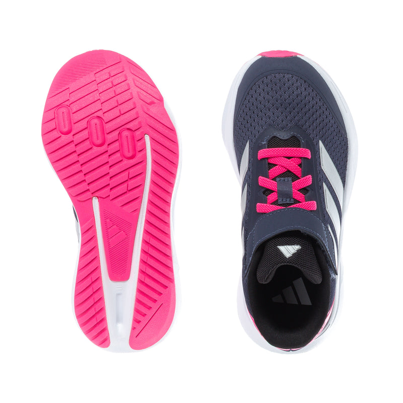 Kids sneaker outsole views: pink tread bottom and dark patterned footbed