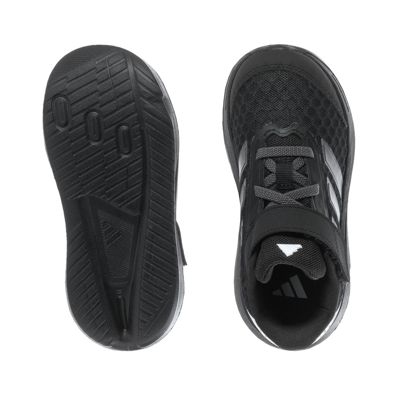 Kids black sneaker outsole with tread pattern and dark mesh upper