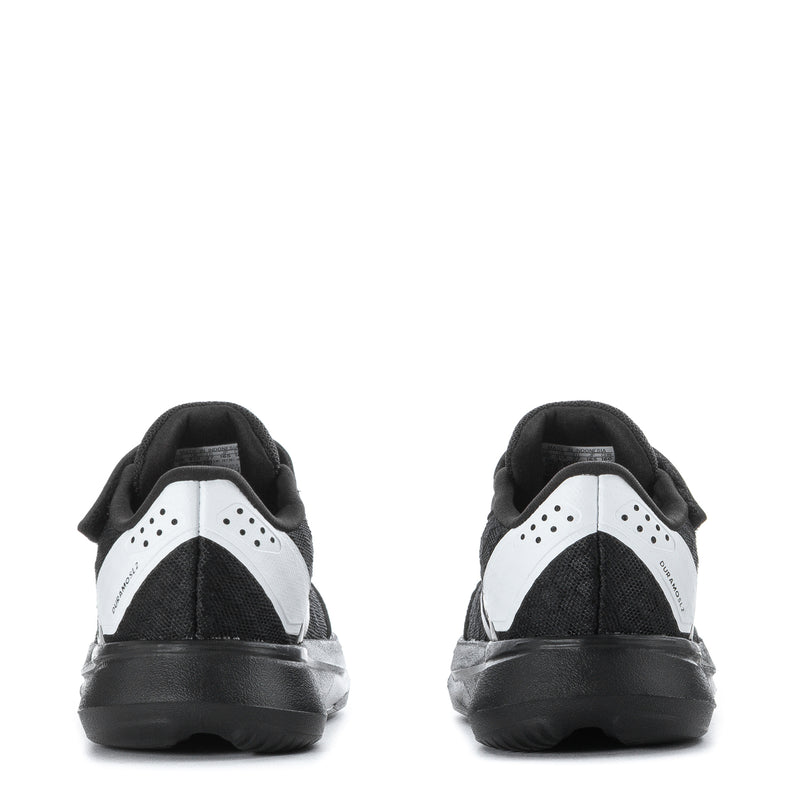 Kids black low-top sneakers with white heel panels and dark rubber outsole