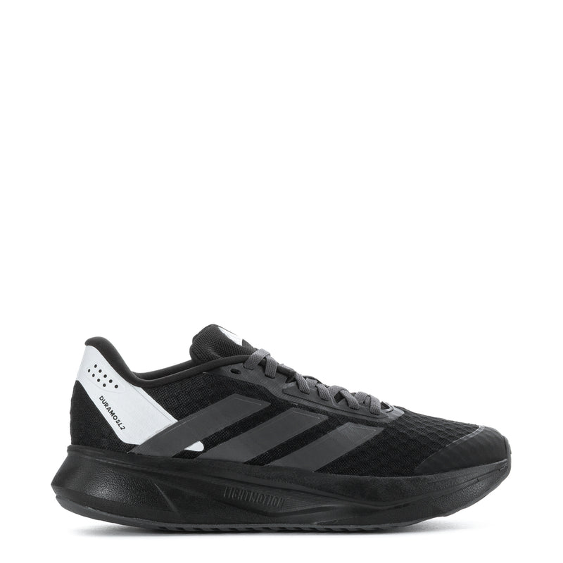 Youth running shoe in black with white and gray logo stripes, lace-up design