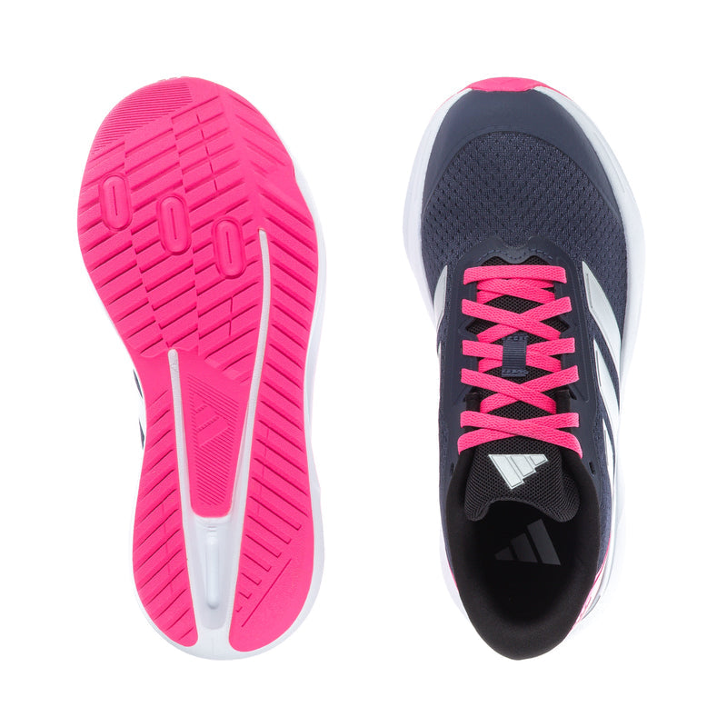 Youth running shoe soles: pink traction outsole with dark upper and pink laces.