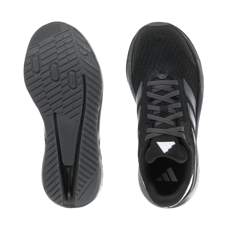 Youth running shoe outsole and toe view, dark rubber tread and black upper