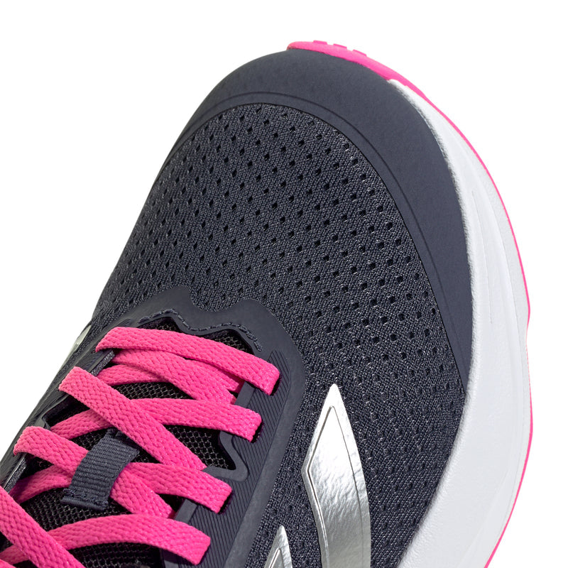 Navy mesh youth running shoe with pink laces and padded collar detail.