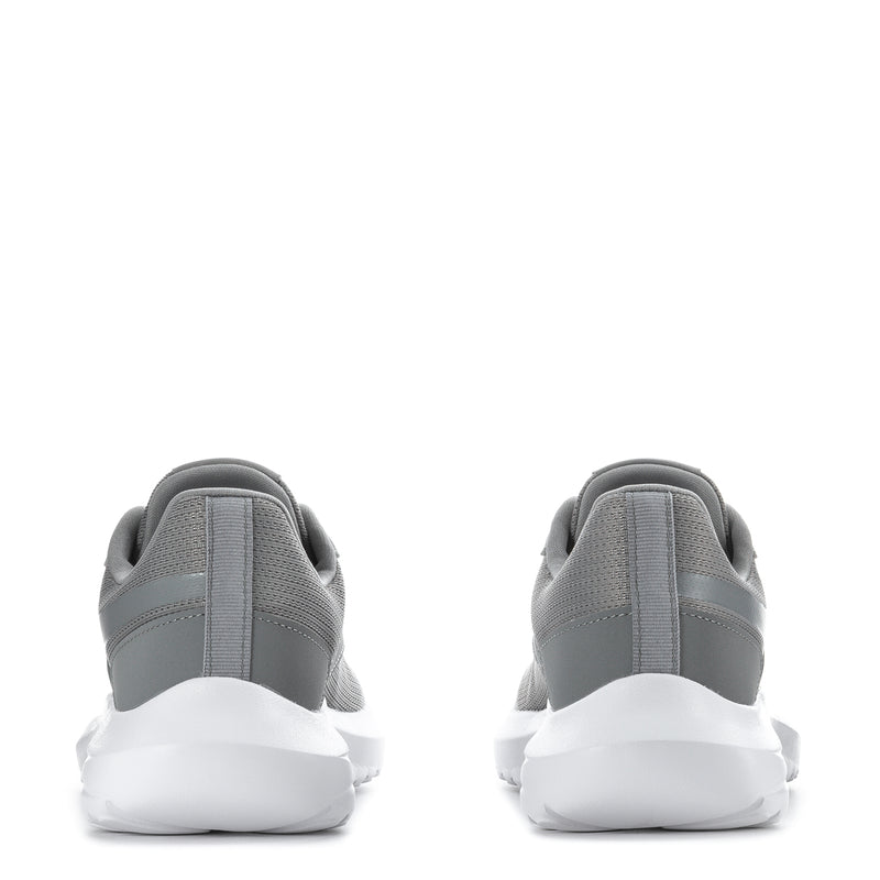 Gray youth sneakers heel view with lace-up closure, padded collar, and white sole