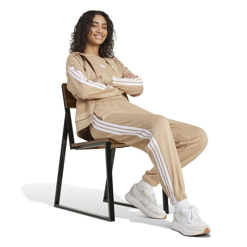 Women’s warm sandstone loose pants with white 3-stripe side panels and jogger cuffs