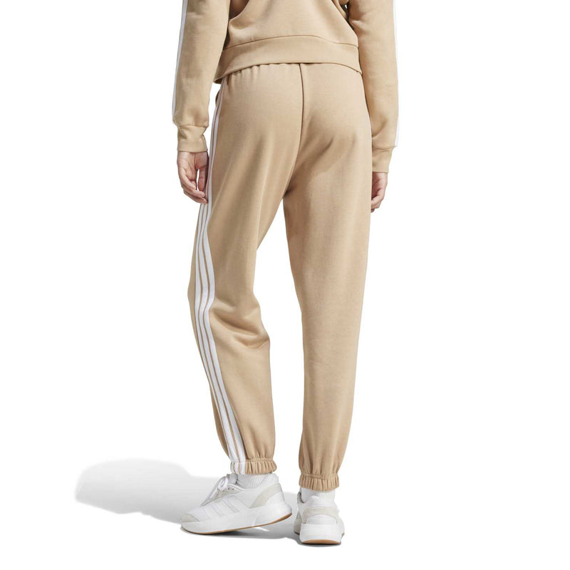 Back view women’s warm sandstone loose jogger pants with white side stripes and elastic hem