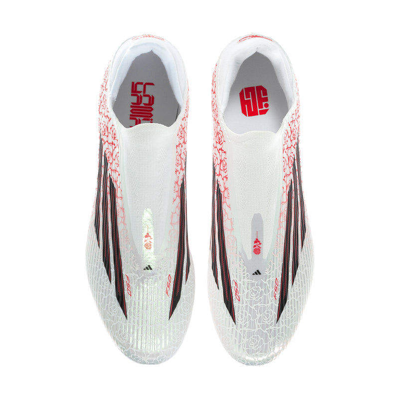 Pair of men's white cleats with red rose pattern and black accents on tongue