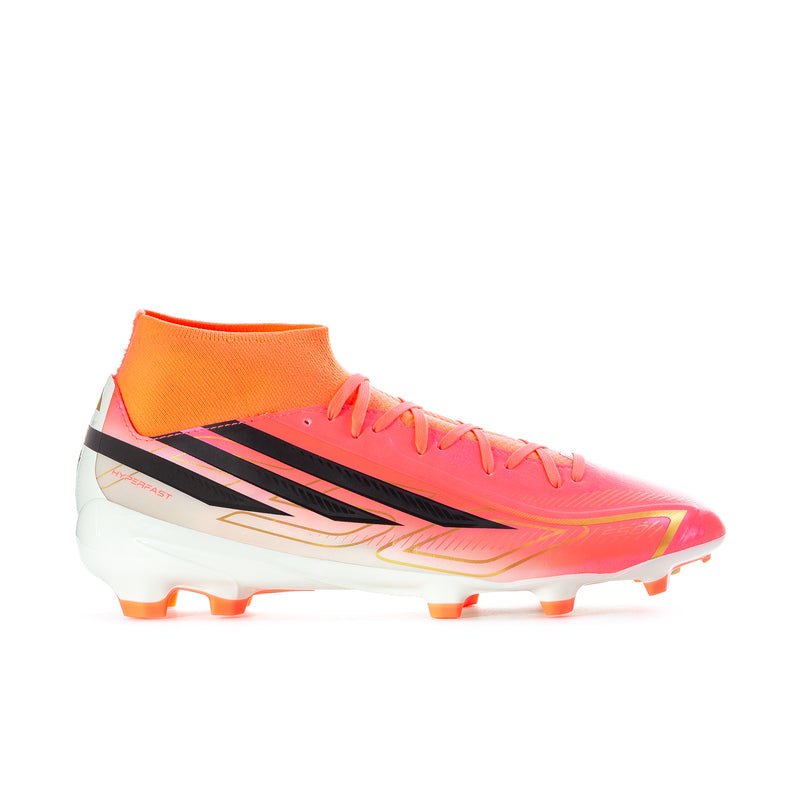 Men's mid soccer cleats in orange with black stripes, white outsole, and molded studs