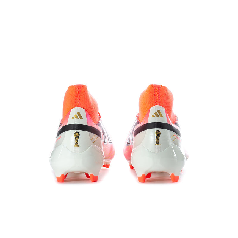 Men's mid soccer cleats back view with orange sock collar and white heel with molded studs