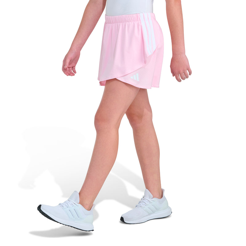 Youth skort in light pink with asymmetrical wrap overlay and side pocket detail