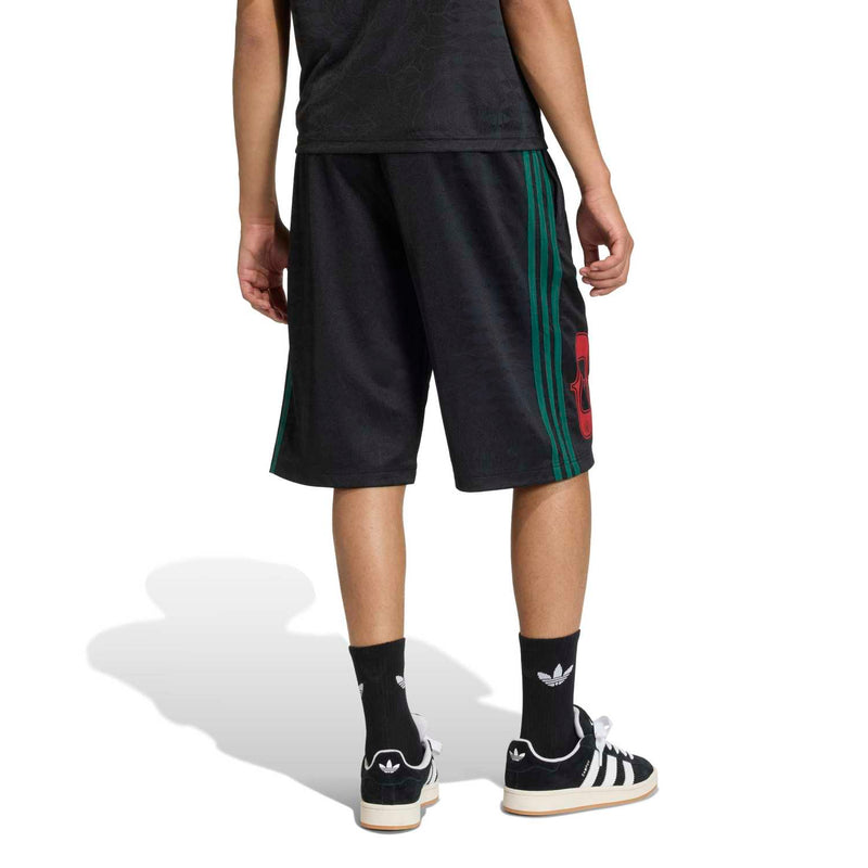 Men's black shorts lower side view with green stripe panel and red 83 graphic