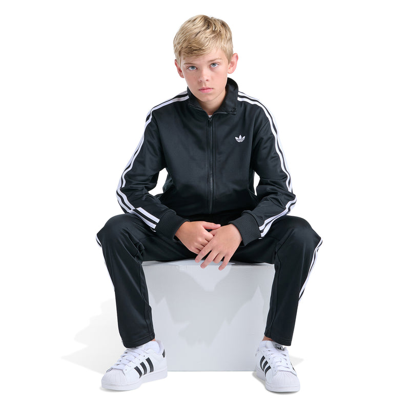 Youth black track jacket with full-zip and white side stripes, small chest trefoil logo