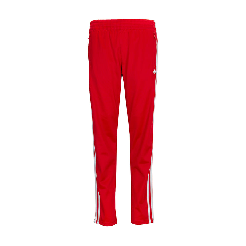 Youth red track pants with white side stripes and elastic cuffs
