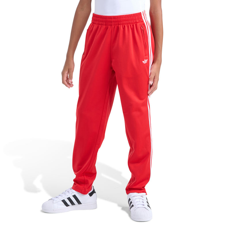 Youth red track pants with elastic waistband and white side stripe detailing