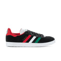 Black suede-look men's sneakers with white stripes, red heel, green accent, white sole