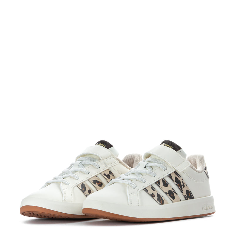 Pair of kids adidas Grand Court sneakers in white with leopard stripe panels and tan soles