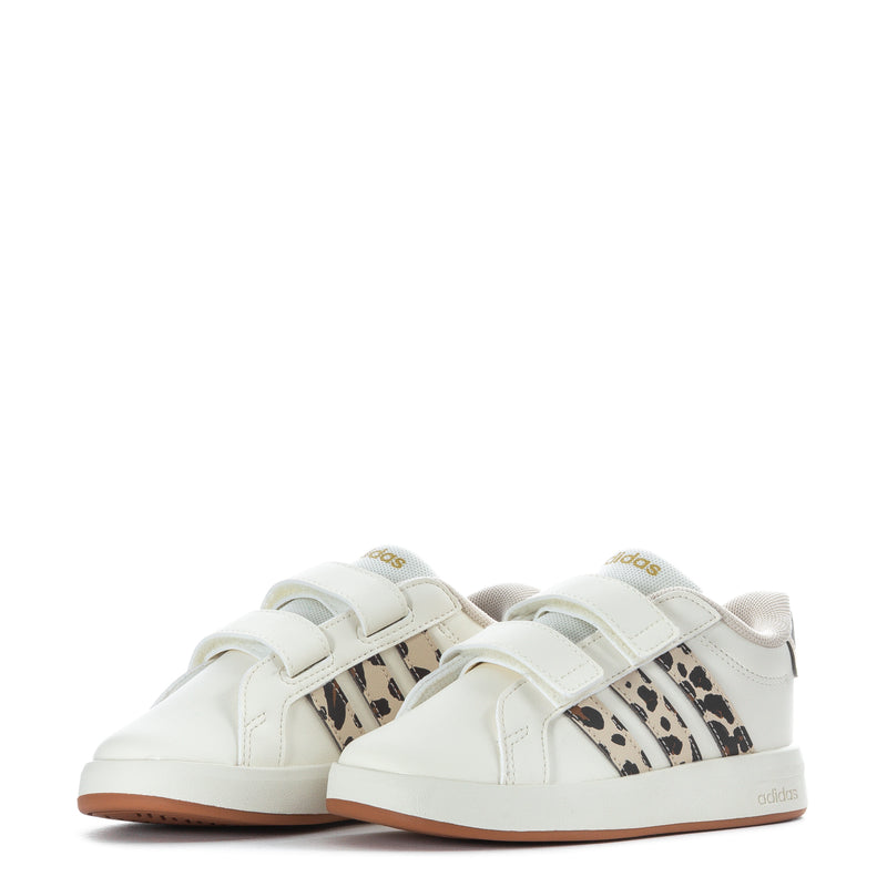 Pair of toddler adidas sneakers, white uppers with leopard-print stripes and gum sole