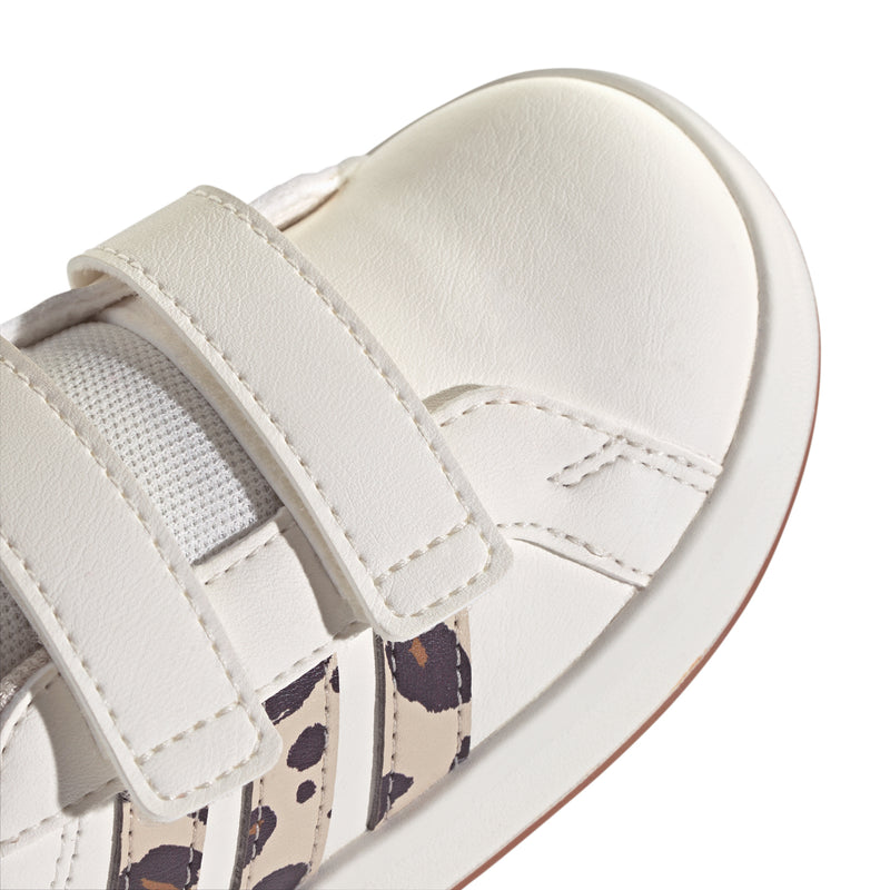 Toddler adidas sneakers close-up, white leather with leopard-print 3-stripe overlay