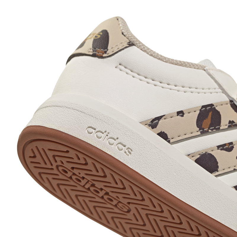 Toddler adidas sneakers close-up, white heel with adidas branding and gum outsole