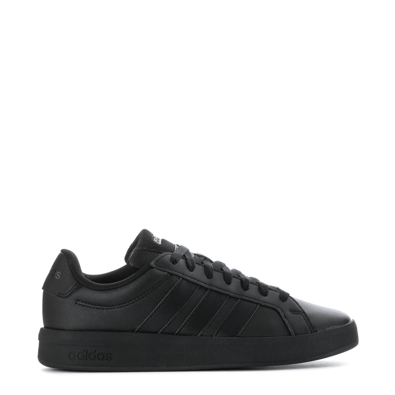 Black youth adidas sneakers with side stripes and lace-up closure