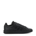 Black youth adidas sneakers with side stripes and lace-up closure