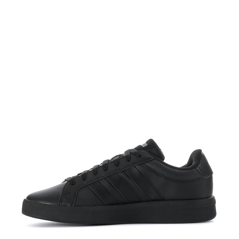 Black youth adidas sneakers, side profile with lace-up and low-cut collar