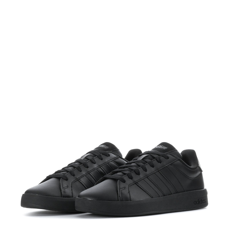 Black youth adidas sneakers, front angle showing two lace-up shoes