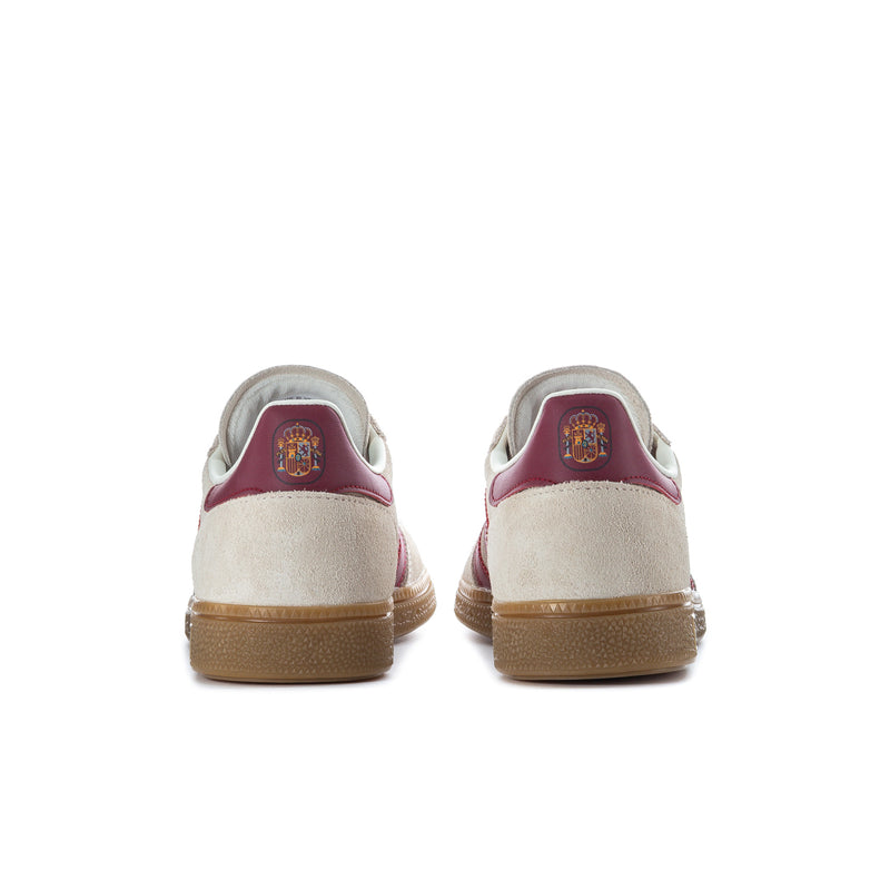 Back view of beige sneakers with burgundy heel panel and gum outsole