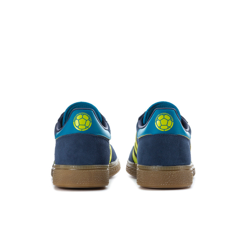 Men's sneakers heel view: navy suede, teal collar, and neon green heel logo