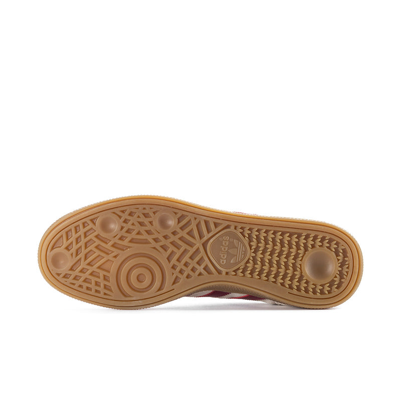Gum rubber outsole with tread pattern and embossed logo