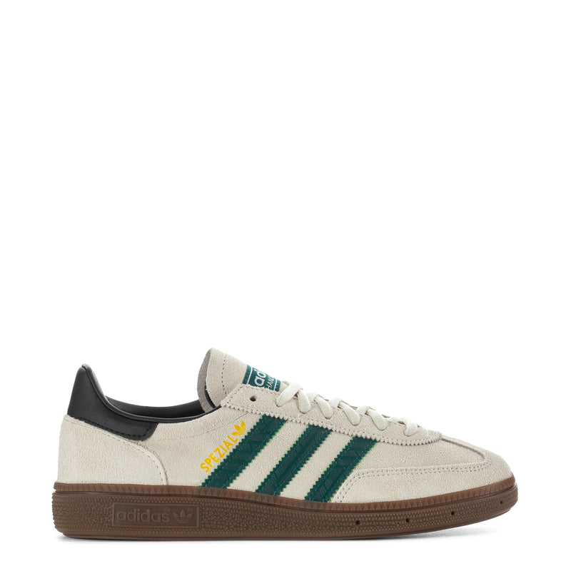 Youth sneakers with off-white leather upper, green striped side, gum rubber sole