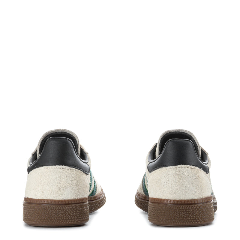 Youth sneakers heel view, off-white leather with black collar and gum sole