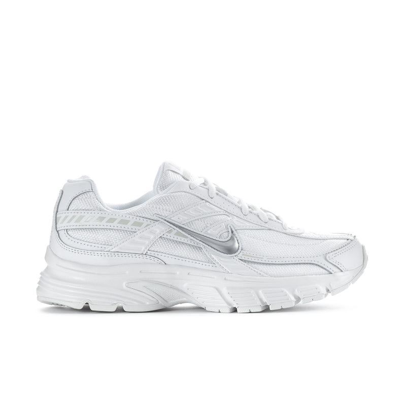 White women's athletic sneakers with padded collar and lace-up front