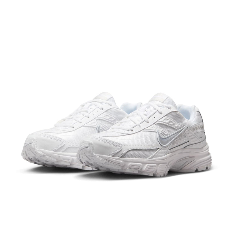 White women's athletic sneakers, side and toe view with chunky rubber sole