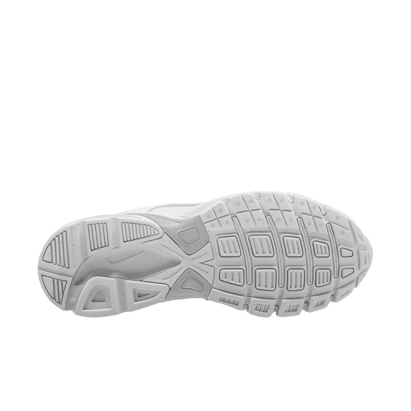 White sneaker outsole with traction tread and molded rubber patterns