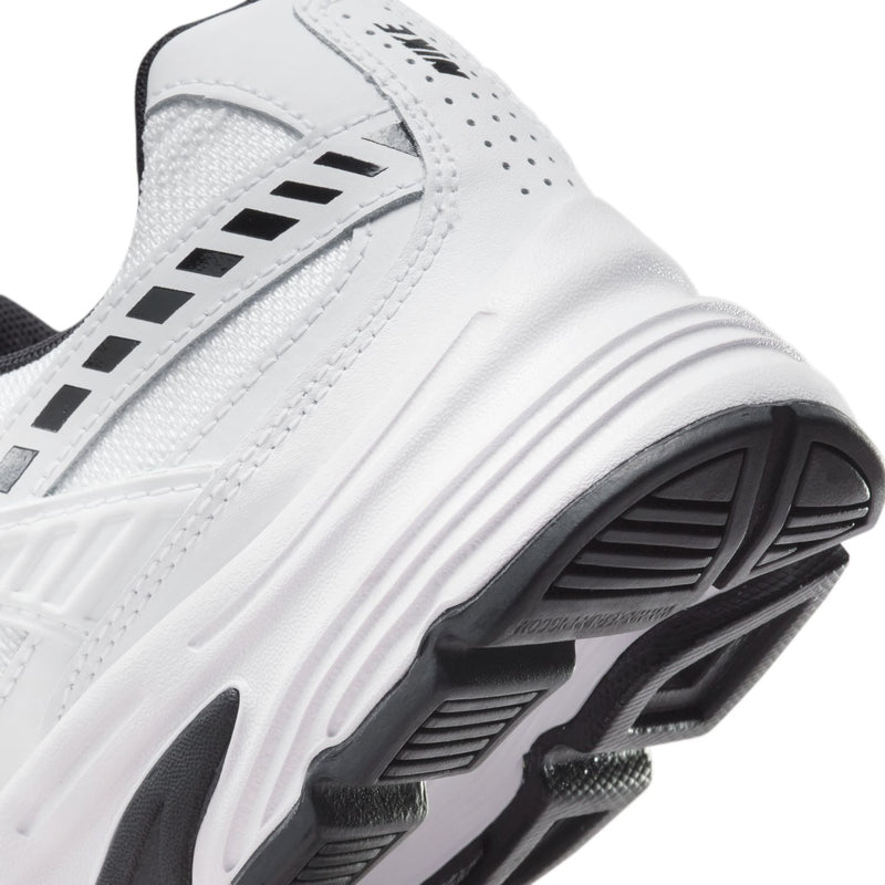 Close-up of white Nike Initiator heel sole with flex grooves and black traction pads.