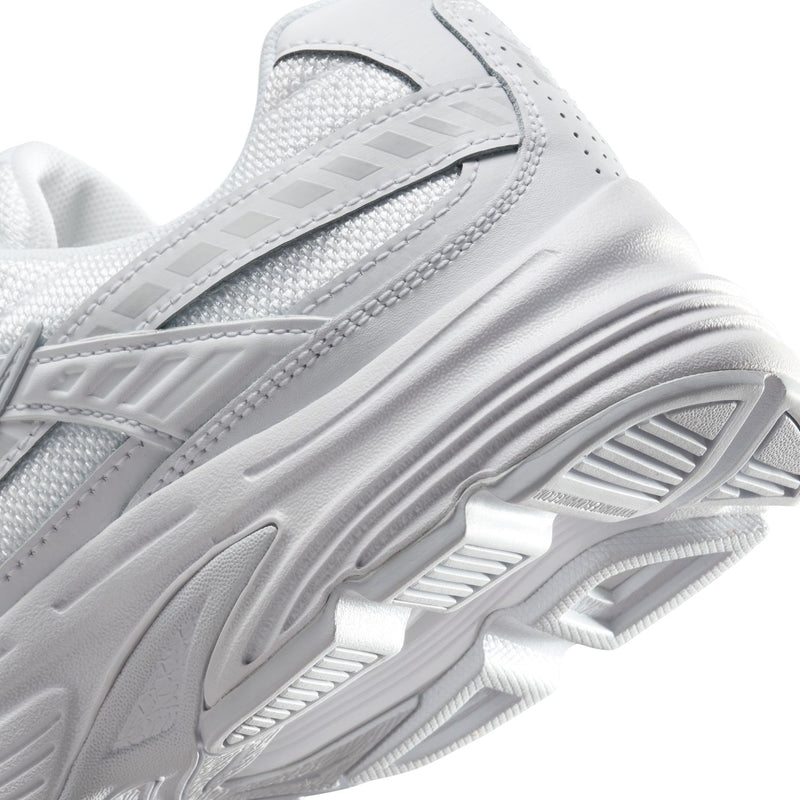 White women's sneaker close-up of midsole cushioning and tread pattern