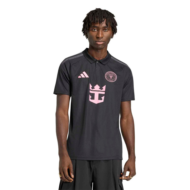 Men's black soccer polo-style jersey with pink crest and center logo graphic